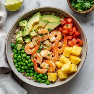 Plate of Coconut Lime Shrimp with Rice garnished with herbs and lime