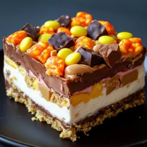 Creamy chocolate peanut butter lasagna dessert with layers and chocolate drizzle