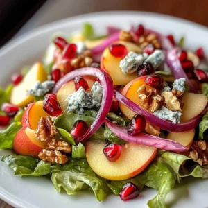 Fresh Honeycrisp Apple Feta Salad with greens and walnuts on a plate